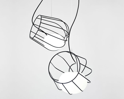martín azúa suspends dipping metallic basket in light container