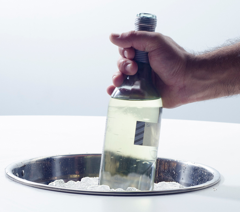 miguel mestre inserts ice bucket into middle of the dine table