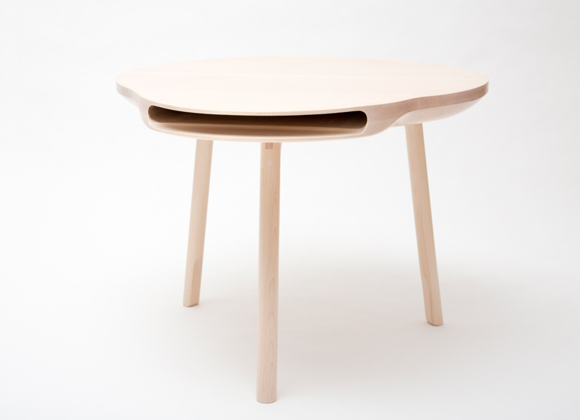 tokyo table by loic bard features discreet storage compartment
