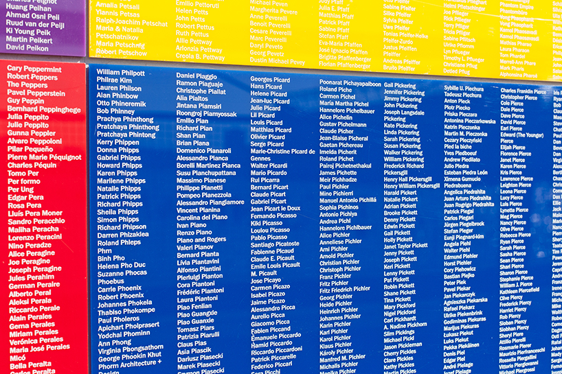 tony tasset carves 392,486 artists' names onto multicolored monument