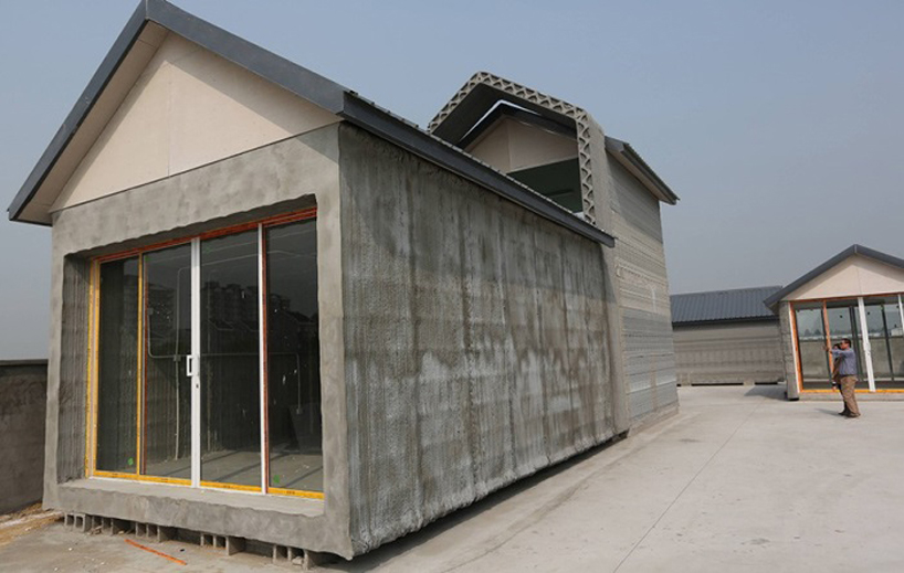 chinese company 3D  prints 10 recycled concrete houses in 