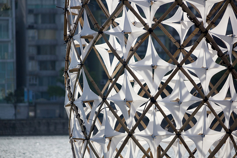 bloom pavilion interweaves bamboo rods on sai van lake in china
