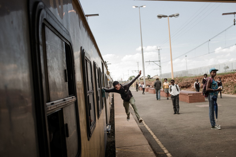 staff riding by marco casino documenting train surfers in south africa