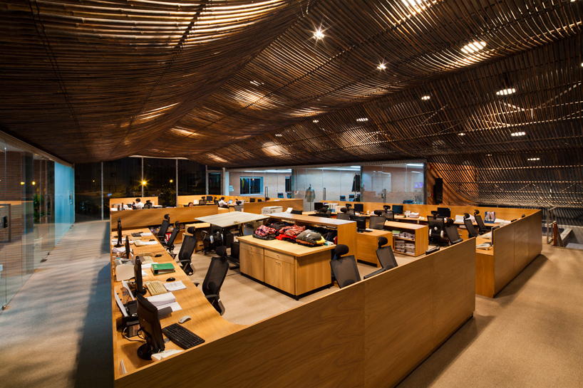 vo trong nghia architects renovates factory office with bamboo ceiling