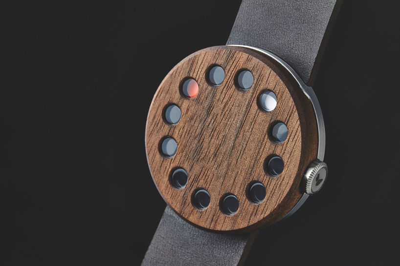 wooden analog watch by grovemade displays time with circular hands
