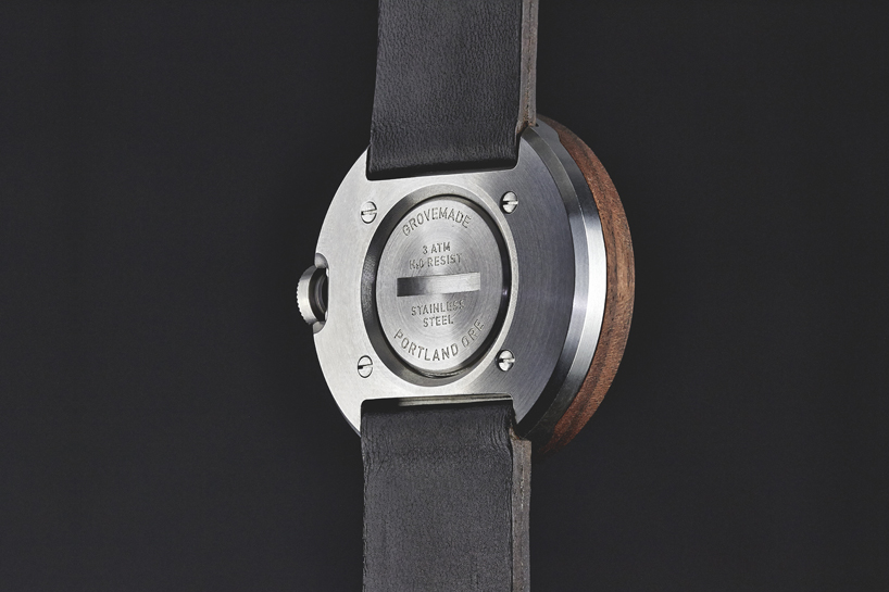 wooden analog watch by grovemade displays time with circular hands