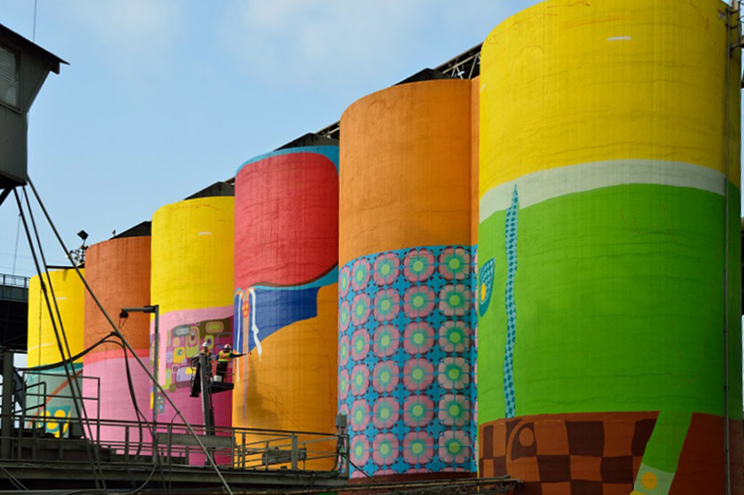 os gemeos colorizes six giant silos on vancouver's granville island