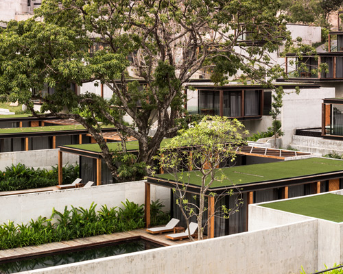 matchbox villas protrude from thai mountainside at naka phuket resort