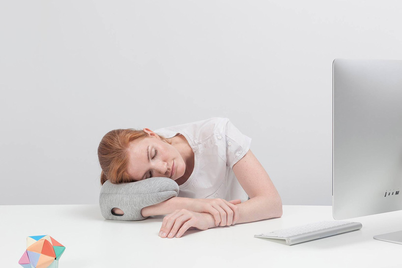 ostrich pillow mini attaches to hand, arm + elbow for easy napping