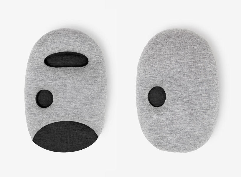 ostrich pillow mini attaches to hand, arm + elbow for easy napping