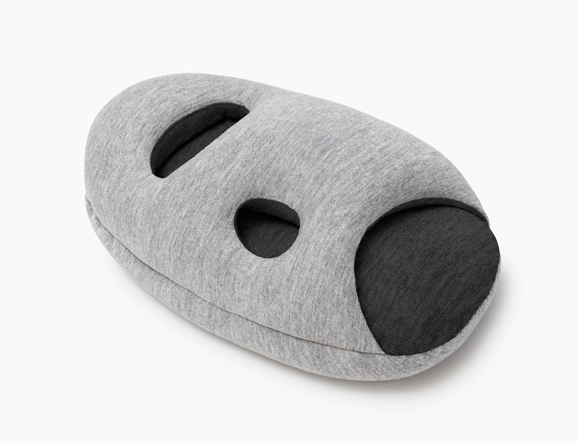ostrich pillow mini attaches to hand, arm + elbow for easy napping