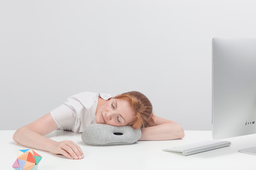ostrich pillow mini attaches to hand, arm + elbow for easy napping