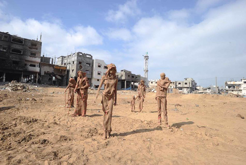 artist sets clay figures within gaza destruction to depict displacement 