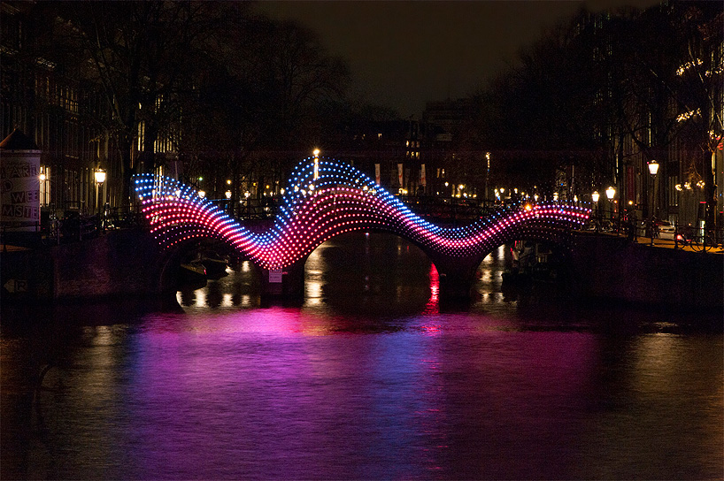 tjep. illuminates amsterdam's canals with undulating light bridge