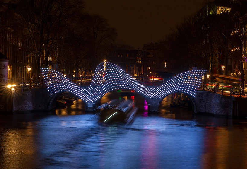 tjep. illuminates amsterdam's canals with undulating light bridge