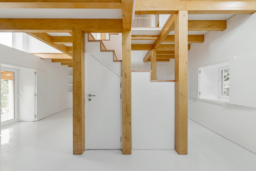 corpo atelier wood structure inside stone walls portugal designboom