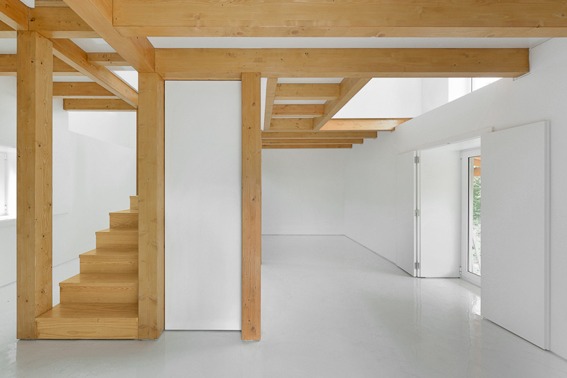 corpo atelier wood structure inside stone walls portugal designboom