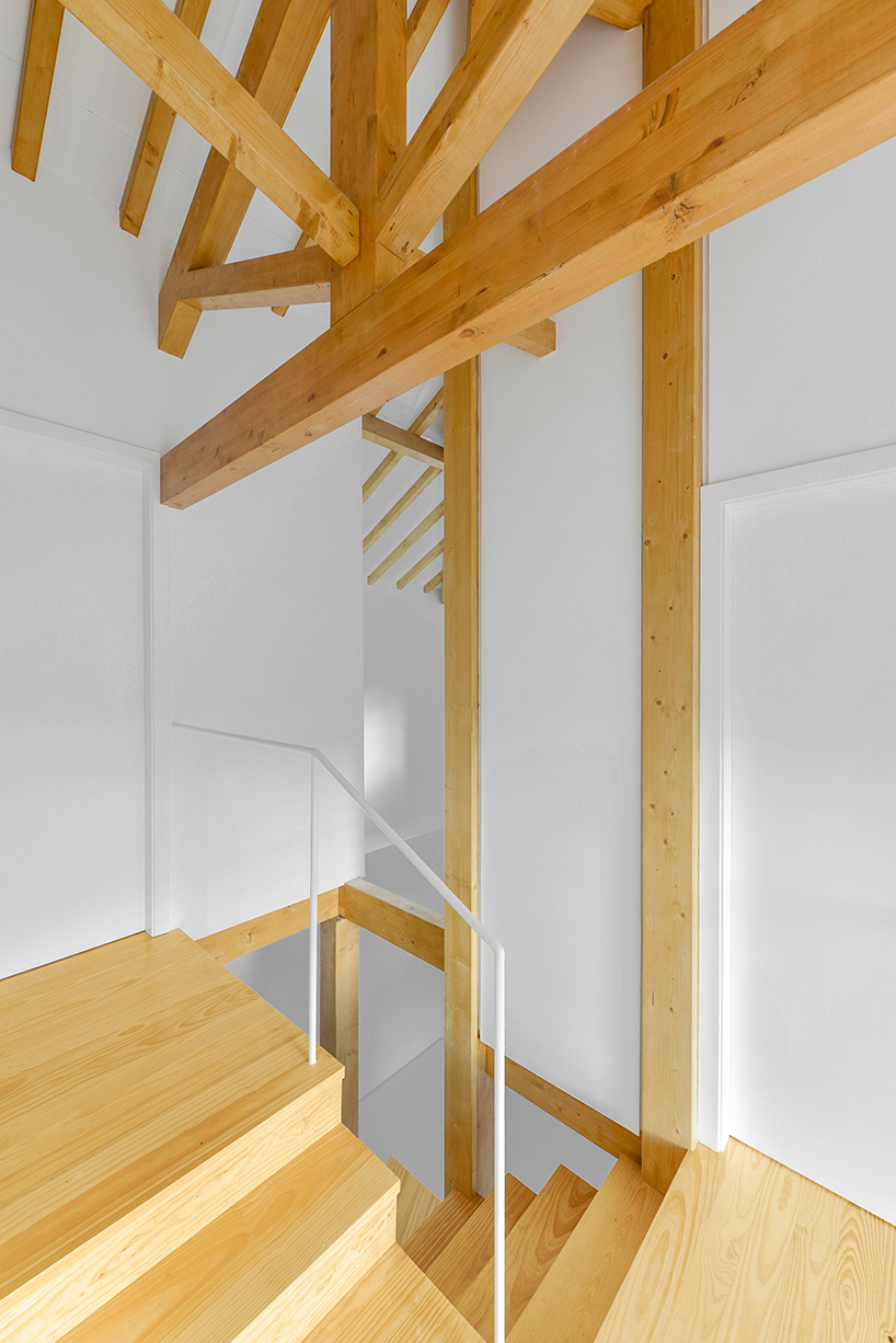 corpo atelier wood structure inside stone walls portugal designboom