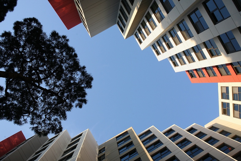 JDS architects unites office + hotel with staggered structure in seoul
