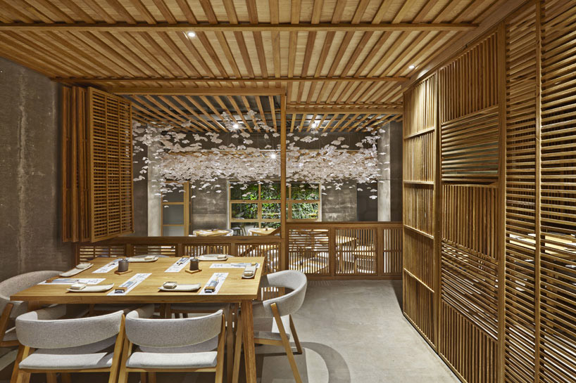 nozomi sushi bar by masquespacio designed as a japanese street