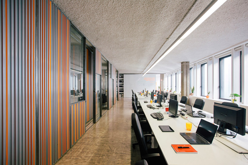 LIKEarchitects adapts kinematix office with moving garage doors