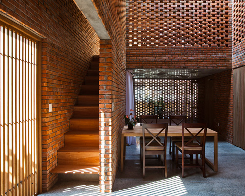 brick home by tropical space is conceived as a termite's nest