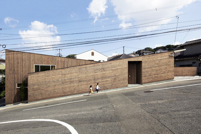 roote angles two-storey family residence on an inclined plot in japan
