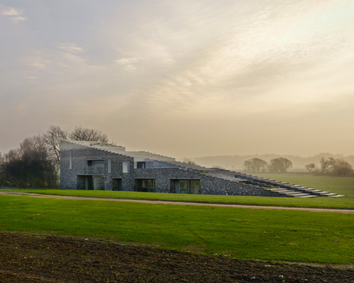 monolithic flint house by skene catling de la peña responds to its rural setting