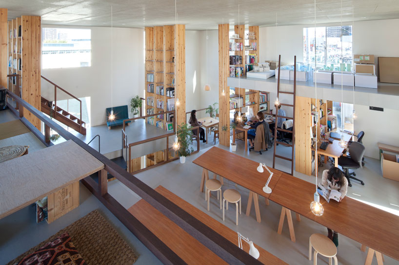 mamiya shinichi's work studio is supported by forest of timber pillars