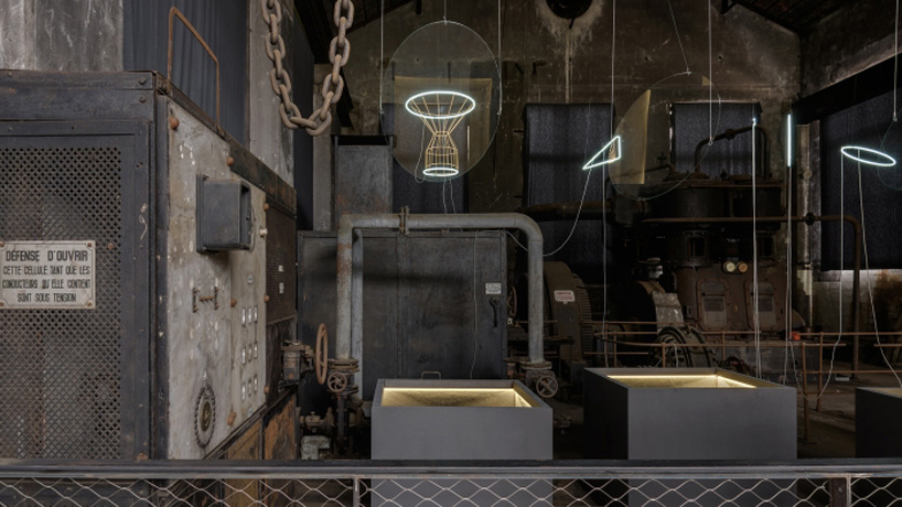 luminaries installation of neon lights and reflection on glass by studio glithero designboom