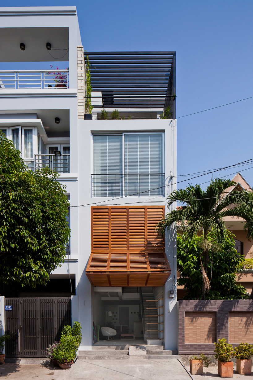MM++ architects townhouse with a folding-up shutter ho chi minh city vietnam designboom