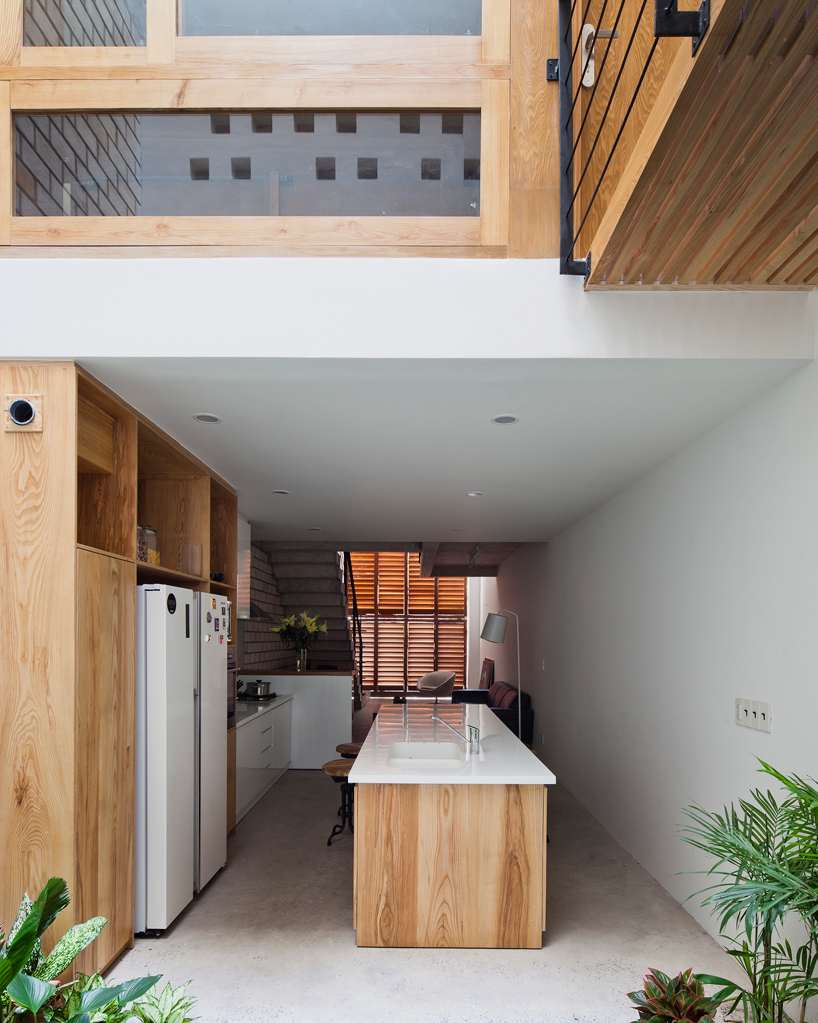 MM++ architects townhouse with a folding-up shutter ho chi minh city vietnam designboom