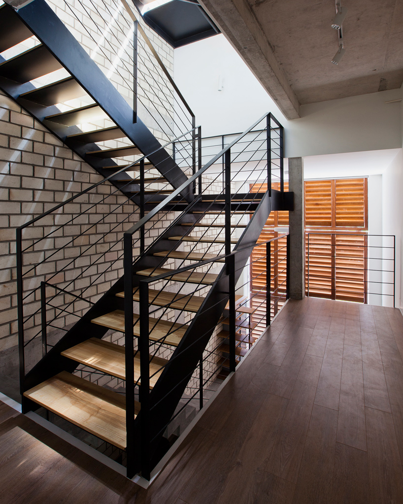 MM++ architects townhouse with a folding-up shutter ho chi minh city vietnam designboom