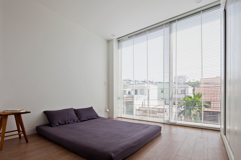 MM++ architects townhouse with a folding-up shutter ho chi minh city vietnam designboom