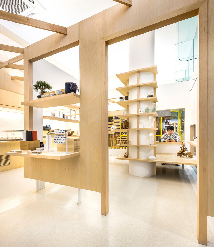 PRODUCE intersects two retail spaces with plywood planes in singapore