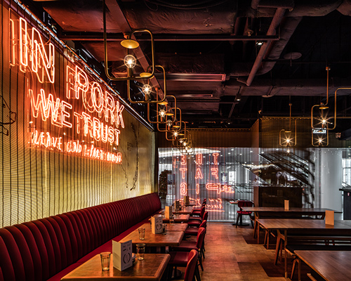 michaelis boyd employs neon detailing inside hong kong's fat pig restaurant