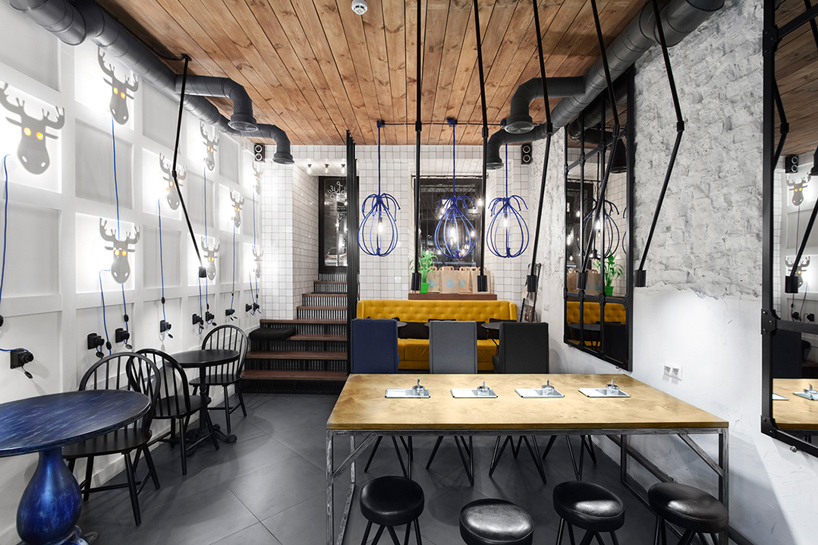 kleydesign tells a story within blue cup coffee shop in kiev