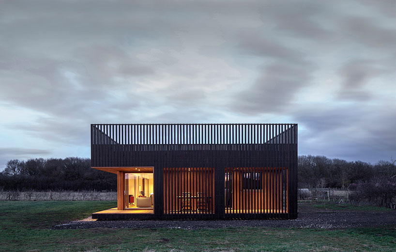 IPT architects clads howe farm residence in charred timber ...