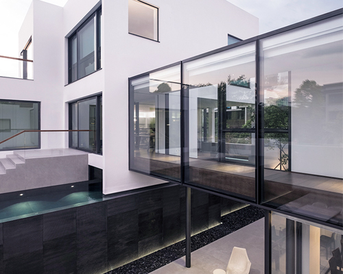 ida & billy links two hong kong houses with glass bridge