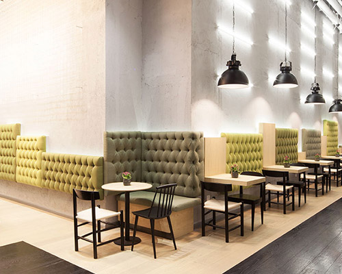 shenzhen's gaga café by coordination asia grows greenery on an indoor trellis