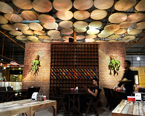 thaipan studio transforms warehouse into noodle restaurant in thailand