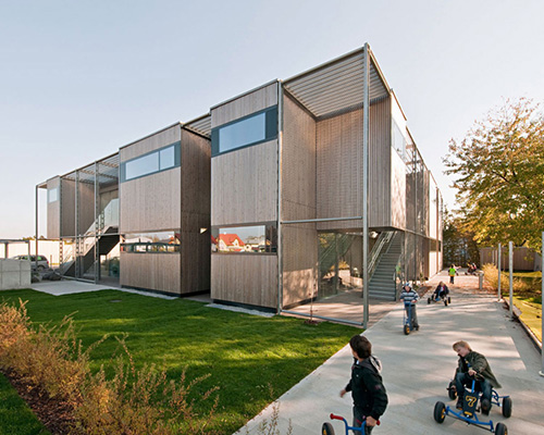 kirsch ZT uses timber & concrete for sustainable kindergarten in vienna