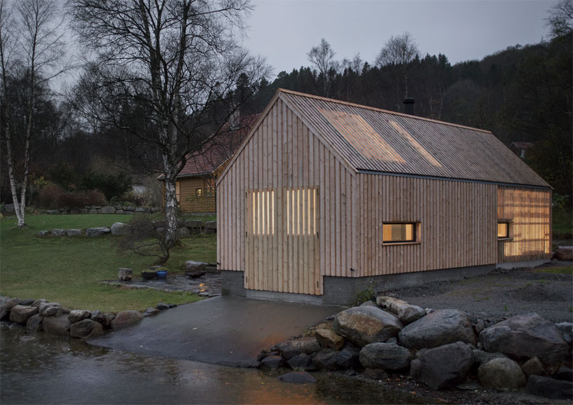 kolab and koreo architects revitalizes timber boathouse in