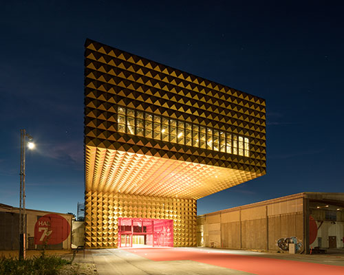MVRDV + COBE open a gold-studded cantilevered rock museum in denmark