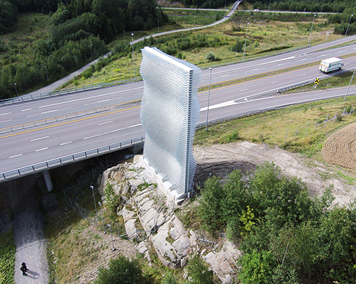 handegård arkitektur realizes reflective roadside landmark in norway