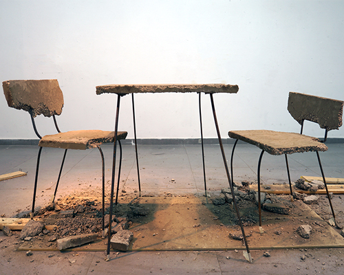 iftach gazit casts table and chair collection from a single slab of concrete