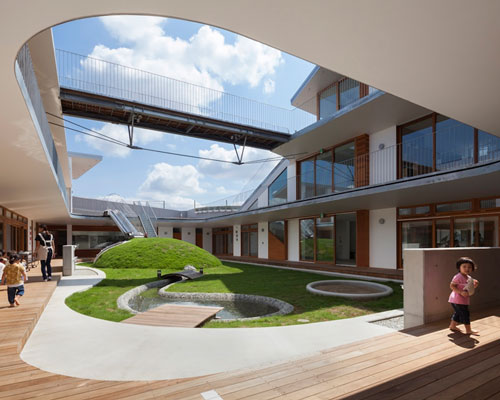 aisaka architects’ atelier organizes japanese nursery around grassy playground