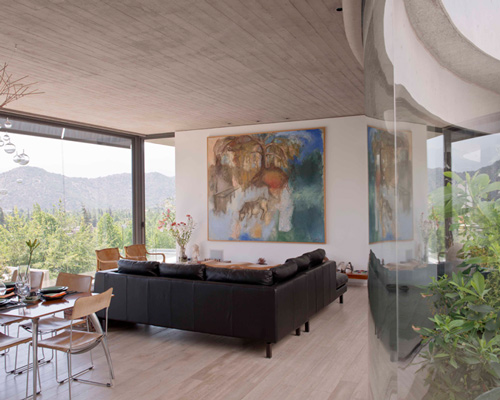 cazú zegers defines whisper house with curving concrete walls in chile