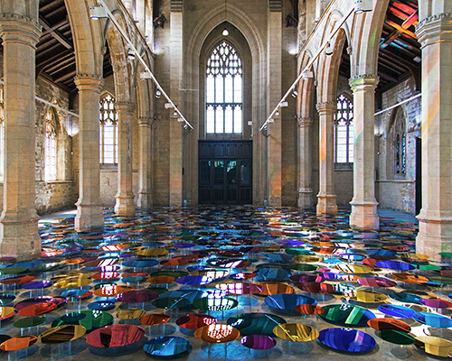 liz west turns historic UK church into a reflective landscape of color and light