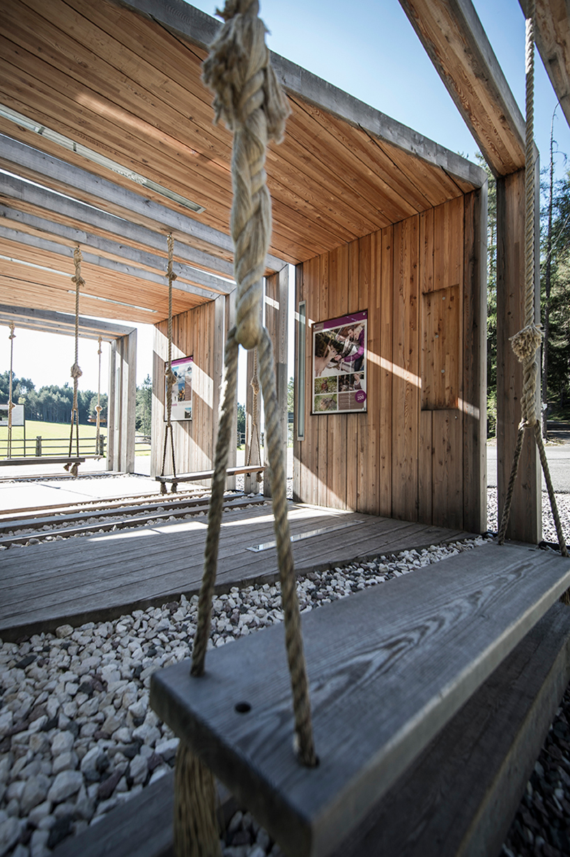 noa* builds swinging frames installation from wooden posts - 1